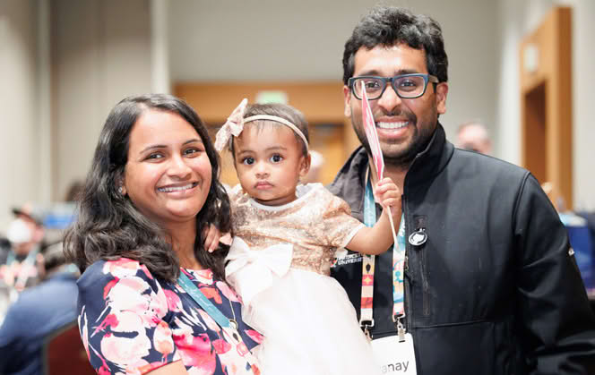 A family with a child at the conference