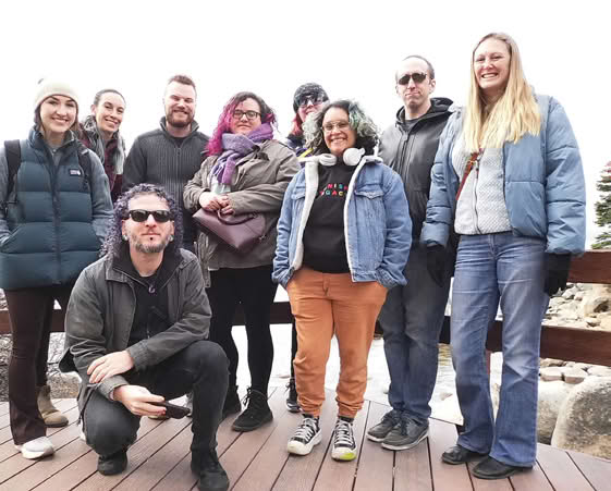 Group of staff members standing together outdoors