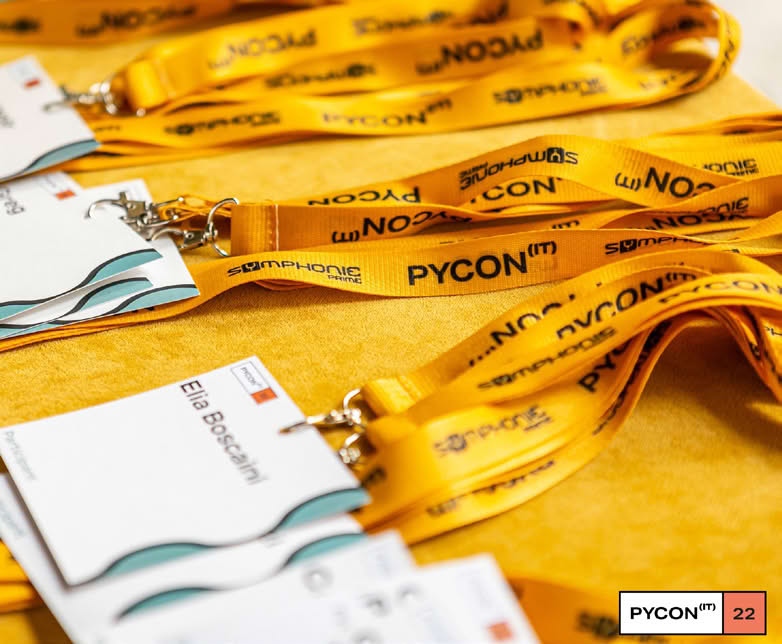 Close-up of yellow lanyards with 'PYCON' text